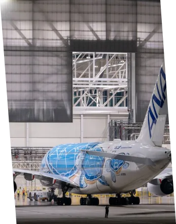 WIDE-BODY AIRCRAFT IN HANGAR WIDE-BODY AIRCRAFT IN HANGAR